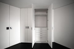 Empty designer closet, working closet with built-in wardrobe in a compact size.