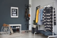 Stylish hallway interior with clothes rack and coat stand
